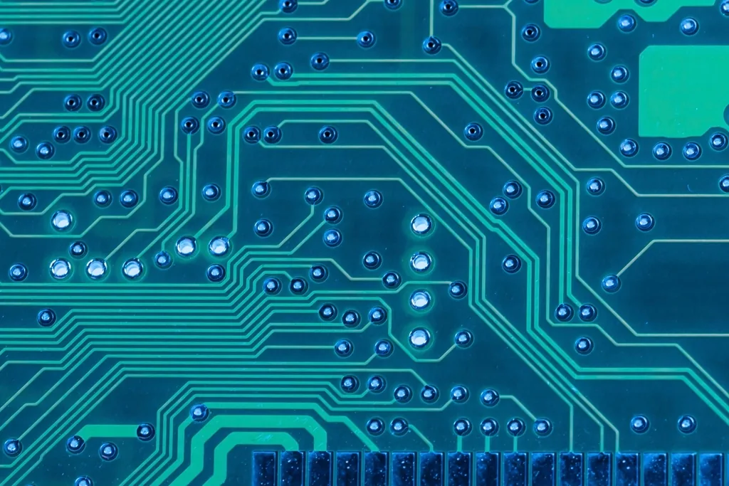 Close-up of a circuit board with glowing cyan traces